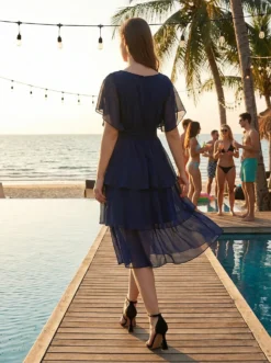 Alege eleganța diafană! Rochie midi albastră din voal, cu volane și mâneci delicate. O ținută vaporoasă, perfectă pentru nuntă sau botez. Livrare rapidă!